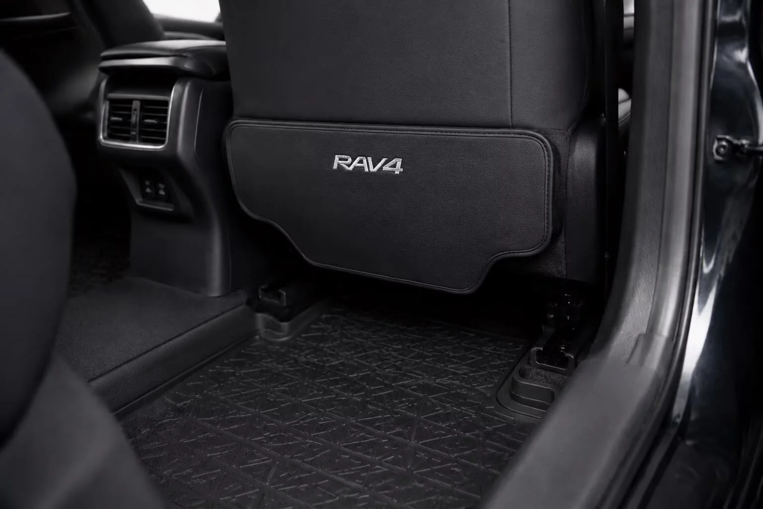 custom-fit kick mat installed flush on RAV4 seat back
