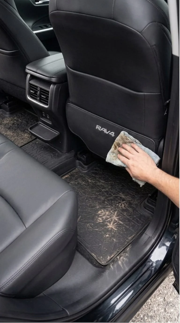 wiping down a seat back kick mat instead of scrubbing fabric trim
